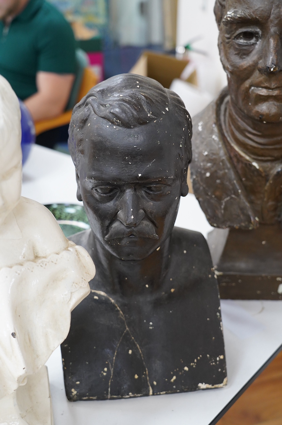 Three decorative plaster busts; the Duke of Wellington, 60cm high, another male figure, and a child. Condition - poor